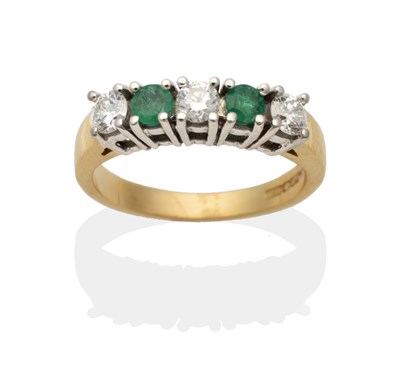 Lot 2100 - An Emerald and Diamond Half Hoop Ring, two round cut emeralds spaced by round brilliant cut...