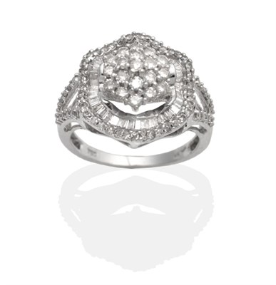 Lot 2108 - A Diamond Cluster Ring, a central cluster of round brilliant cut diamonds in claw settings...