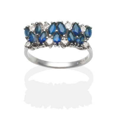 Lot 2122 - An 18 Carat White Gold Sapphire and Diamond Half Hoop Ring, two rows of marquise cut sapphires...