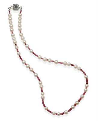 Lot 2123 - A Pink Tourmaline and Cultured Pearl Necklace, pink tourmaline beads spaced at intervals by...