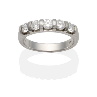 Lot 2124 - A 9 Carat White Gold Diamond Half Hoop Ring, five round brilliant cut diamonds in bar settings,...