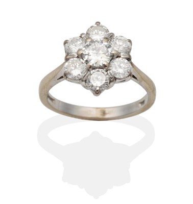 Lot 2126 - An 18 Carat White Gold Diamond Cluster Ring, a central round brilliant cut diamond within a...