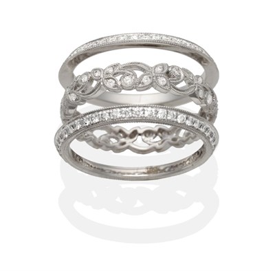 Lot 2127 - An 18 Carat White Gold Triple Band Eternity Ring, three seperate bands comprising a central diamond