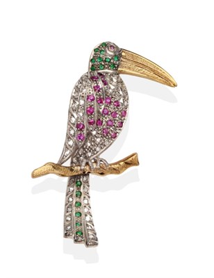 Lot 2131 - A Diamond, Ruby and Emerald set Toucan Brooch, modelled perched on a branch and set throughout with