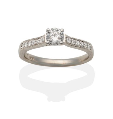 Lot 2133 - An 18 Carat White Gold Diamond Solitaire Ring, a round brilliant cut diamond in a claw setting,...