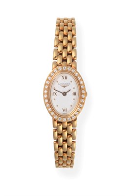 Lot 2194 - A Lady's 18ct Gold Diamond Set Wristwatch, signed Longines, model: Prestige, ref: L6 110 7,...