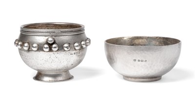 Lot 2244 - An Arts and Crafts Silver Footed Bowl, Gilbert & Co, Birmingham 1938, with hammered finish...