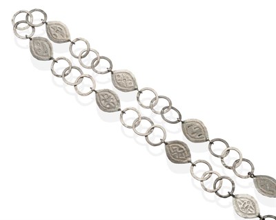 Lot 2005 - A Necklace, by Guy Royle, formed of leaf pattern links alternating with three hammered hoops,...