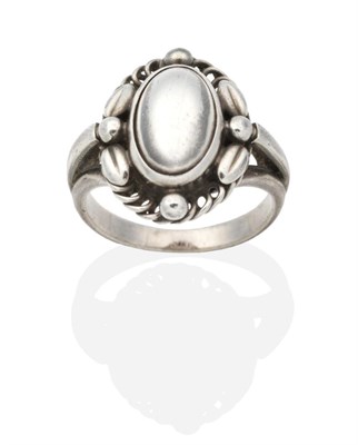 Lot 2008 - A Georg Jensen 'Moonlight Blossom' Ring, model number 1A, an oval cabochon within a rope and...