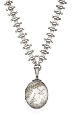 Lot 2026 - A Victorian Locket on Chain Necklace, an oval locket with engraved decoration featuring herons,...