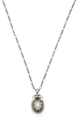 Lot 2028 - A Silver Georg Jensen 'Pendant of the Year', 1992, on Chain, a silver oval cabochon within a scroll