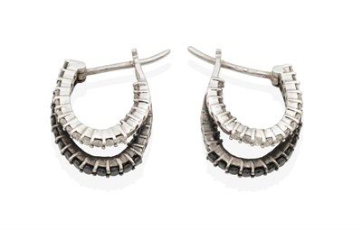 Lot 2032 - A Pair of 18 Carat White Gold Black and White Diamond Half Hoop Earrings, formed of a hoop of white