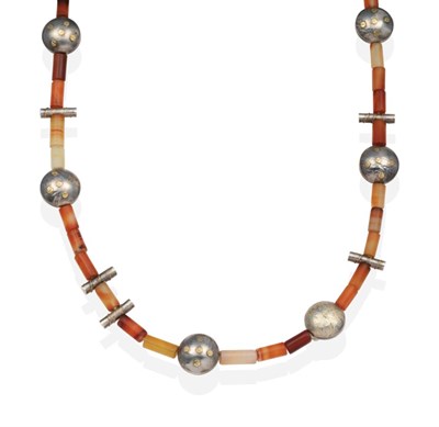 Lot 2047 - A Silver and Carnelian Bead Necklace, by Barbara Christie, sand blasted carnelian barrel-shaped...