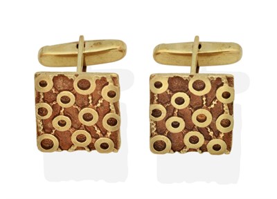 Lot 2050 - A Pair of 9 Carat Gold Textured Cufflinks, rectangular heads with a carved circular motif, to...