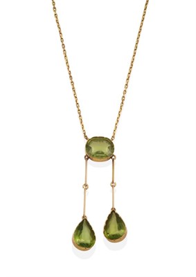 Lot 2052 - A Peridot Negligee Necklace, an oval cut peridot in a collet setting suspending two pear cut...