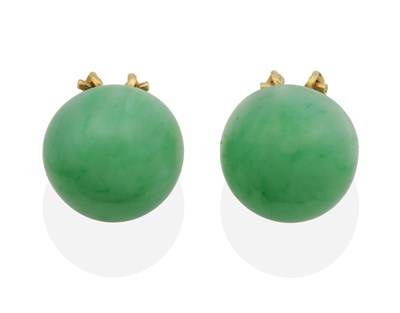 Lot 2053 - A Pair of Jade Earrings, as round cabochons, with French clip fittings, measure 15mm in...