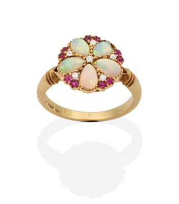 Lot 2062 - An 18 Carat Gold Opal Ruby and Diamond Cluster Ring, a circular top inset with five pear cut opals