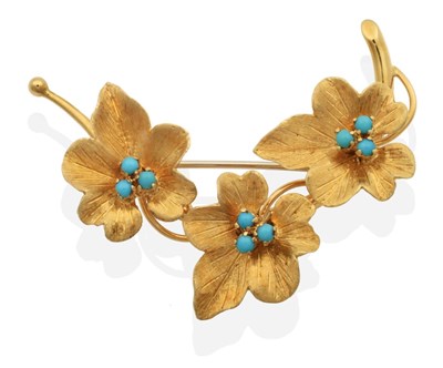 Lot 2066 - An 18 Carat Gold Turquoise Spray Brooch, three textured flower heads each set with three turquoise