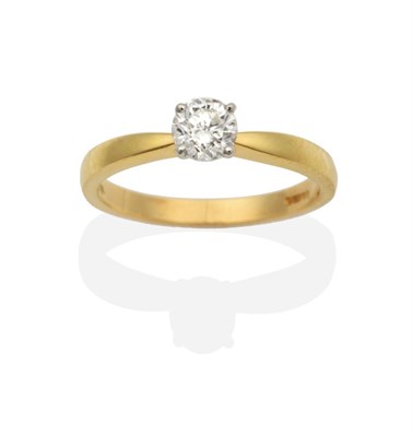 Lot 2075 - An 18 Carat Gold Solitaire Diamond Ring, a round brilliant cut diamond in a claw setting, to...