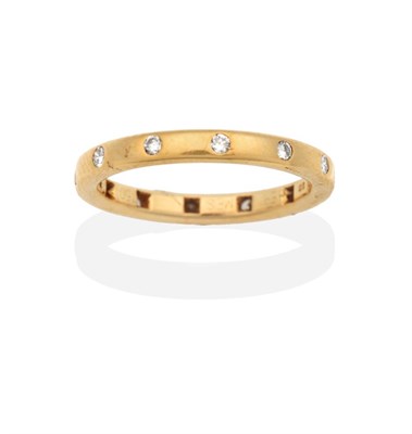 Lot 2085 - An 18 Carat Gold Diamond Eternity Ring, signed 'Hermes', a flat sided shank inset with round...