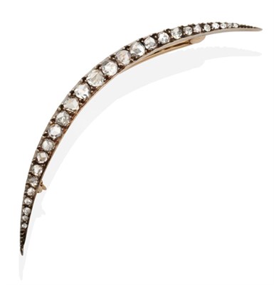 Lot 2087 - A Diamond Crescent Brooch, set throughout with graduated rose cut diamonds in claw settings,...