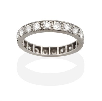 Lot 2095 - A Diamond Eternity Ring, round brilliant cut diamonds in claw settings, total estimated diamond...