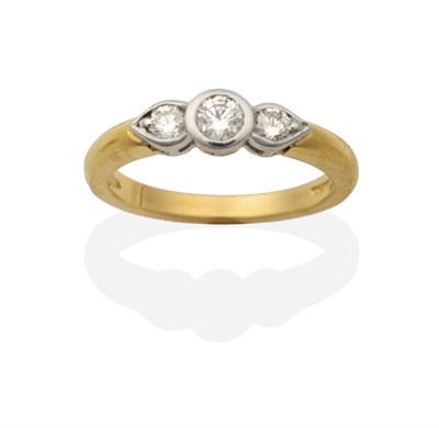 Lot 2106 - An 18 Carat Gold Diamond Three Stone Ring, round brilliant cut diamonds in rubbed over...