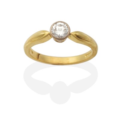 Lot 2108 - An 18 Carat Gold Solitaire Diamond Ring, a round brilliant cut diamond in a rubbed over setting, to