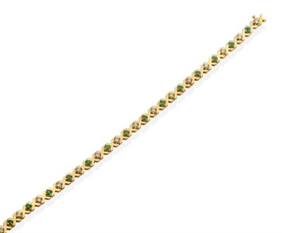 Lot 2115 - An Emerald and Diamond Bracelet, round cut emeralds alternating with round brilliant cut...