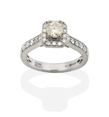 Lot 2124 - A Platinum Diamond Ring, a round brilliant cut diamond in a diamond set square border, to...