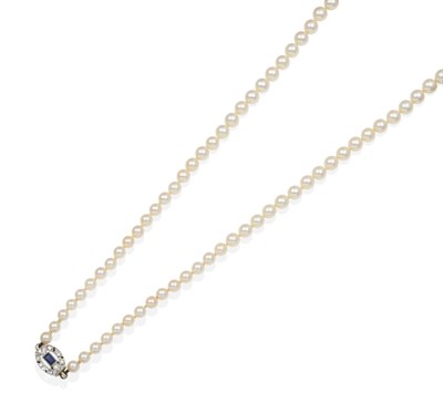 Lot 2134 - A Cultured Pearl Necklace, with a Sapphire and Diamond Set Clasp, a single strand of graduated...