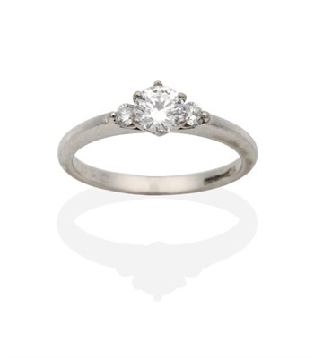 Lot 2140 - An 18 Carat White Gold Solitaire Diamond Ring, a round brilliant cut diamond in a claw setting,...