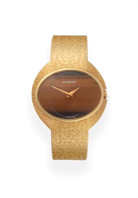 Lot 2193 - A Lady's 18ct Gold Wristwatch, signed Juvenia, circa 1975, lever movement, tigers eye dial,...