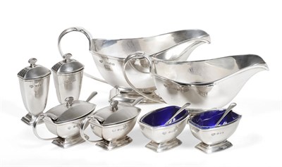 Lot 2200 - A Graduated Pair of Art Deco Silver Sauceboats and Condiment Set En-Suite, Goldsmiths &...