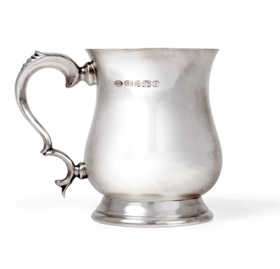 Lot 2218 - A Modern Silver Mug, Mappin & Webb, Sheffield 1999, in the George III style with baluster body...