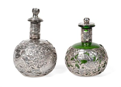 Lot 2242 - Two Chinese Export Silver Mounted Glass Scent Bottles, Wang Hing, circa 1900, the larger clear...