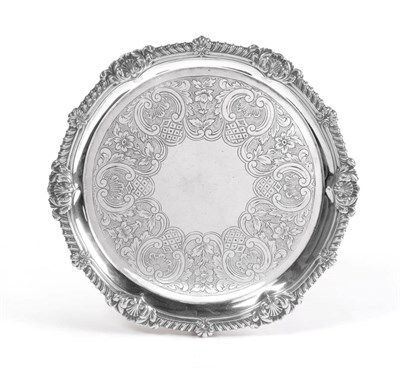 Lot 2254 - A George III Silver Salver, Paul Storr, London 1815, with gadroon and foliate shell border, on...