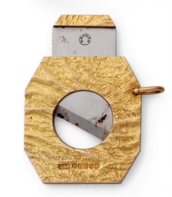 Lot 2269 - A 9ct Gold Cigar Cutter, Ramsden & Roed, London 1962, rectangular with cut corners and textured...