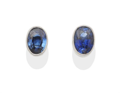 Lot 2001 - A Pair of 18 Carat White Gold Sapphire Stud Earrings, oval cut sapphires in milgrain settings, with