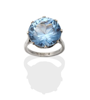 Lot 2004 - A Solitaire Blue Ziron Ring, a round cut blue zircon in a claw setting, to knife edge...