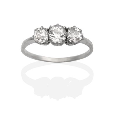 Lot 2010 - A Diamond Three Stone Ring, graduated old cut diamonds in claw settings, to knife edge...