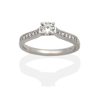 Lot 2018 - An 18 Carat White Gold Solitaire Diamond Ring, a round brilliant cut diamond in a claw setting,...