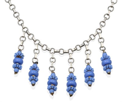 Lot 2022 - A Chrome and Glass Necklace, Attributed to Jakob Bengel, six blue glass pendant drops,...