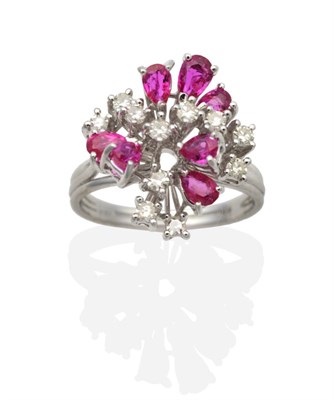 Lot 2023 - A Ruby and Diamond Cluster Ring, vari-sized pear cut rubies, intersperced with eight-cut...