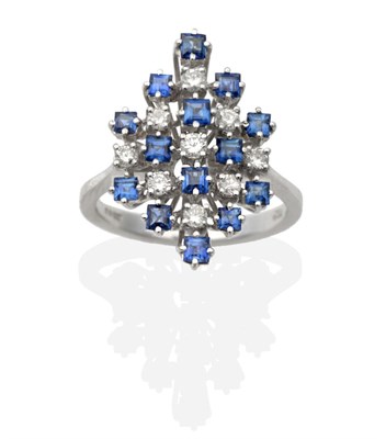 Lot 2027 - An 18 Carat White Gold Sapphire and Diamond Cluster Ring, the kite-shaped top set with...