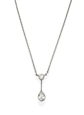 Lot 2028 - A Platinum Diamond Pendant Necklace, a round brilliant cut diamond in a rubbed over setting,...