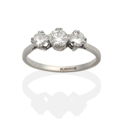 Lot 2035 - A Three Stone Diamond Ring, graduated round brilliant cut diamonds in double claw settings, to...