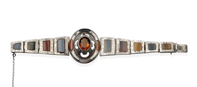 Lot 2045 - A Victorian Scottish Citrine and Hardstone Bracelet, an oval cut citrine in a rubbed over...