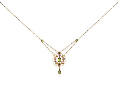 Lot 2049 - An Edwardian Peridot and Amethyst Pendant Necklace, a circular knife edge frame with round cut...