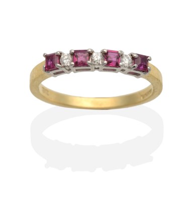 Lot 2056 - An 18 Carat Gold Ruby and Diamond Half Hoop Ring, square cut rubies in claw settings, spaced by...